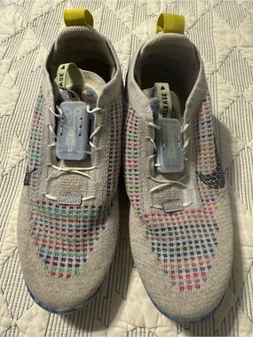 Nike Gray Flyknit Sneakers with Multicolor Knit Accents
